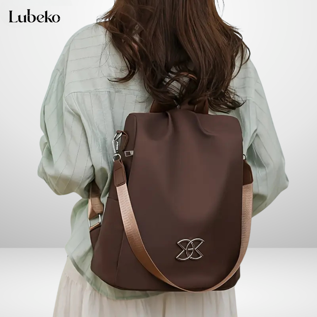 Brown anti theft travel bag worn as a backpack