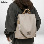 Beige anti theft travel bag worn over the shoulder