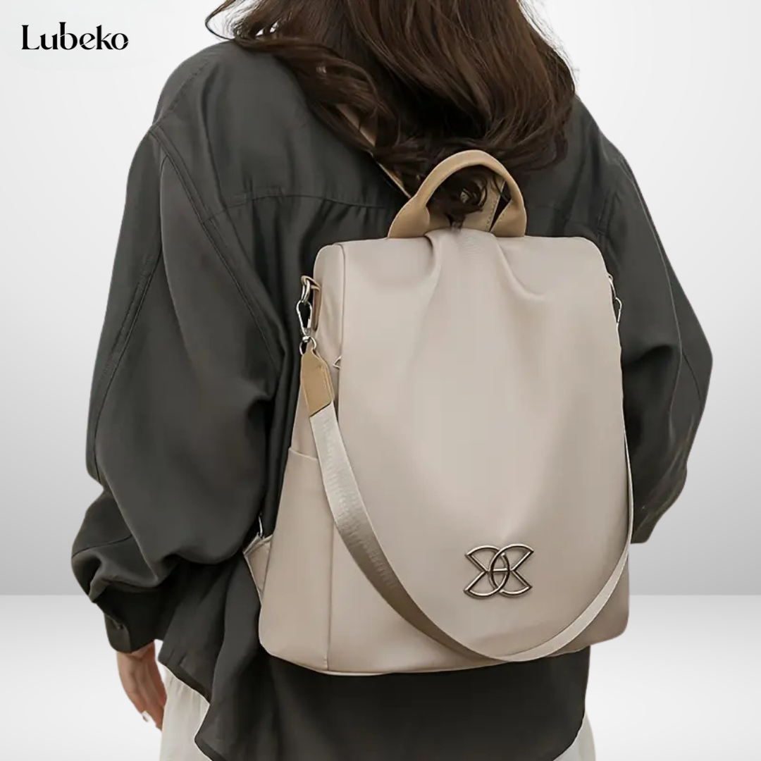 Beige anti theft travel bag worn over the shoulder
