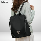 Beige anti theft travel bag angled side view
