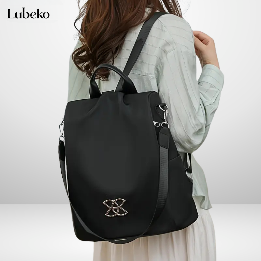 Beige anti theft travel bag angled side view