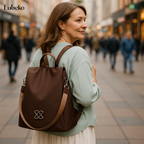 Brown anti theft travel bag worn in the city