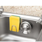 Self adhesive sponge caddy holding a cleaning sponge
