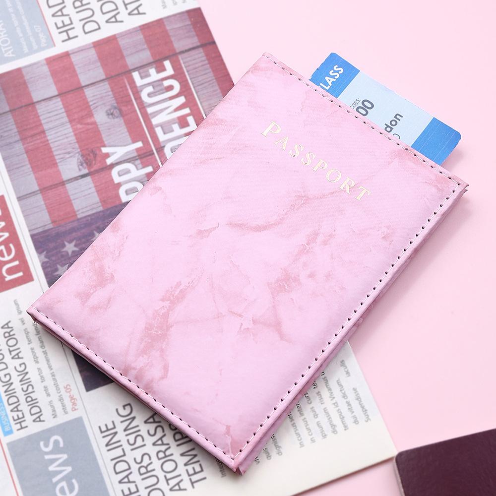 Marbelle passport holder open with organised travel documents
