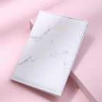White Marbelle faux leather passport holder