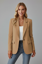 Model wearing a camel womens blazer jacket with a white top and jeans