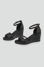 Cushioned orthopedic sandals on a light grey background