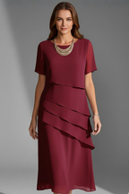 Red layered short sleeve dress with straight knee-length hem, front view