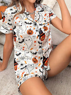 Womens Halloween pyjama set with ghost and pumpkin print, styled view