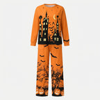 Haunted Manor Halloween pyjama set in orange, long sleeve top and wide-leg pants laid flat