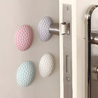 HushPad protective wall padding behind a door handle in four colours