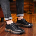 Man wearing black arch support shoes with jeans