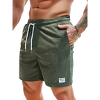 Green swim shorts elastic waist and drawcord, detail