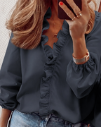 Frilly ruffle top in black with ruffle-trimmed V-neckline