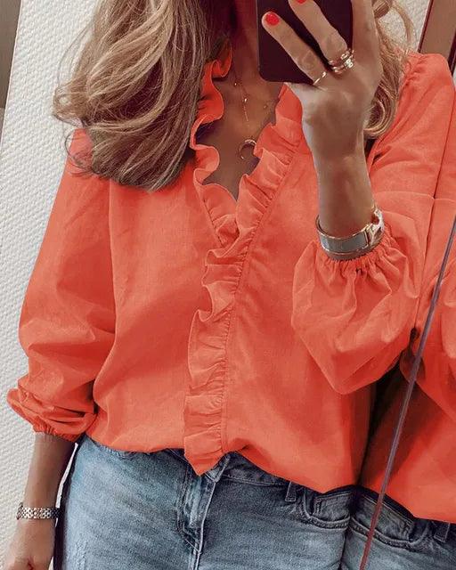 Frilly ruffle top in orange with ruffle-trimmed V-neckline