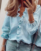 Frilly ruffle top in blue with ruffle-trimmed V-neckline